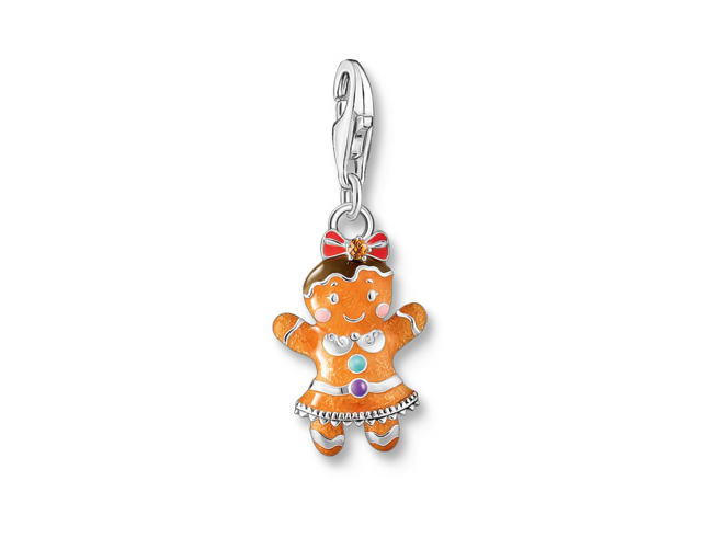 Buntes Thomas Sabo Lebkuchen-Mädchen Charm aus Silber mit Emaille und Zirkonia, zeigt ein fröhliches Lebkuchenmädchen in einem dekorativen Kleid mit Schleife und bunten Akzenten.