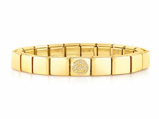 Armband von Nomination aus Edelstahl mit PVD-Beschichtung in Gelbgold, verziert mit einem lächelnden Smiley und funkelnden Steinen. Ideal für einen eleganten Look.